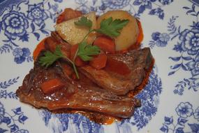 meat dish with vegetables in a plate