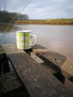 coffee mug on the pier
