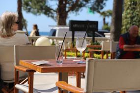 tables with chairs and glasses
