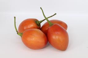 fresh tomatoes on a white background