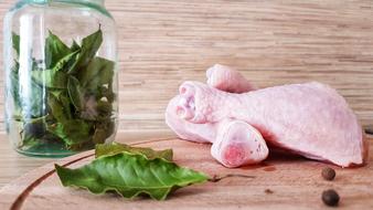 Raw chicken legs with basil