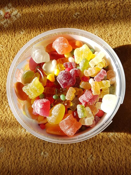 Delicious sugar lollipops in a bowl