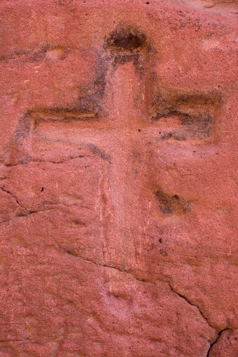 red wall with a cross on it