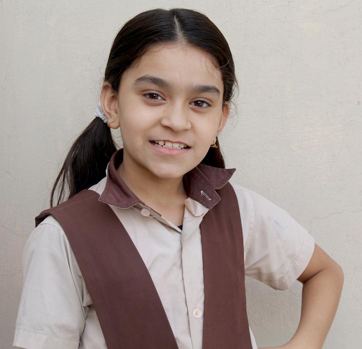 Portrait of the smiling girl in the Indian school