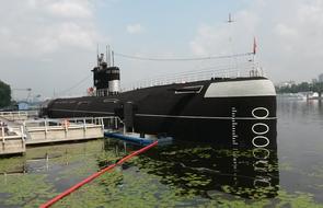 the big black ship on the pier