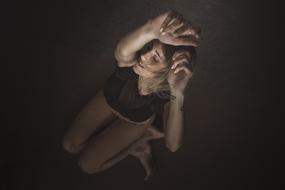 beautiful girl posing with raised arms