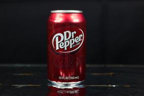 red can of carbonated beverage