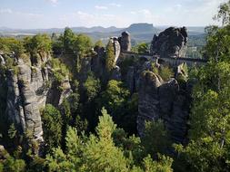 large stone rocks with green trees