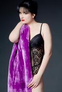a girl in black pajamas with a purple robe