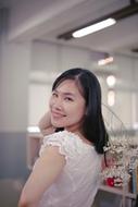 asian girl in a white dress is beautiful