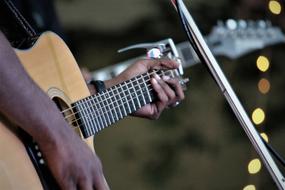 closeup view of guitar player is a Musician who plays the guitar