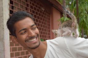 a man with a cat is a joy