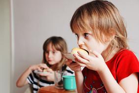 Children eating and drinking in the building