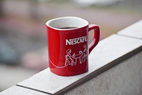 red mug on the window