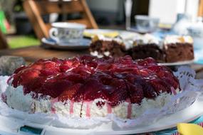Sweet delicious cream cake decorated with strawberries