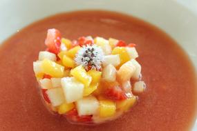 red soup with fruit