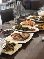 Meat and vegetables on plates at the restaurant