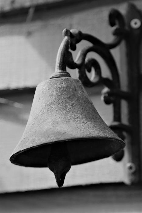 monochrome picture of metal bell
