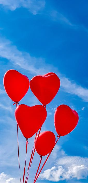 red heart sky blue background