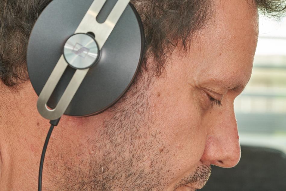 Headphone on head of adult Man