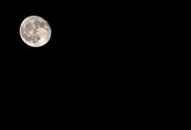 full moon in the sky at night in space