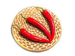 three long peppers on the table