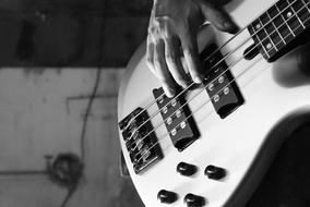 white electric bass guitar