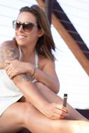 girl in sunglasses with vape