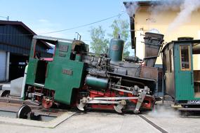 Old and colorful, retro steam locomotive, on the Schafberg Railway in Austria, with the steam