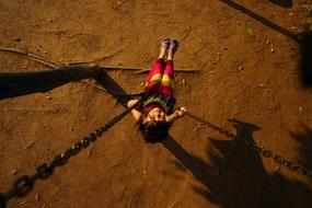 Child Swinging on park