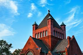 red church building on a blue background