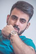 handsome man with a gold watch on his hand