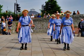 morris dancers wearing purple dresses