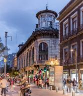 Beautiful cityscape with the people on the streets of the city with colorful lights