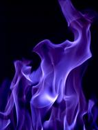 photo of blue flame on black background