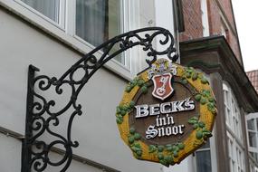 round wooden sign on the wall