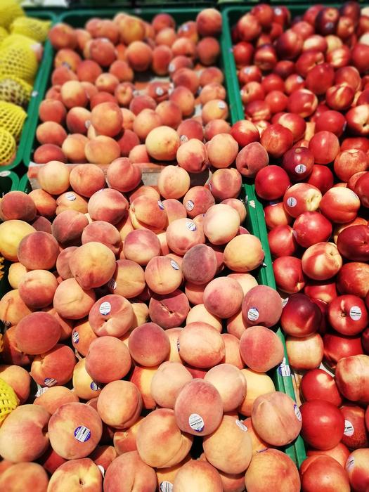 ripe red peaches in boxes, Background