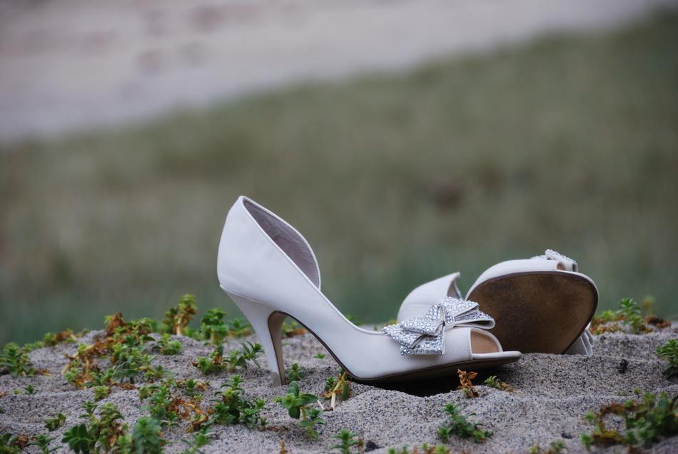 white women's shoes on a stone