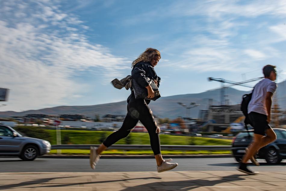 Girl Running Pan on street