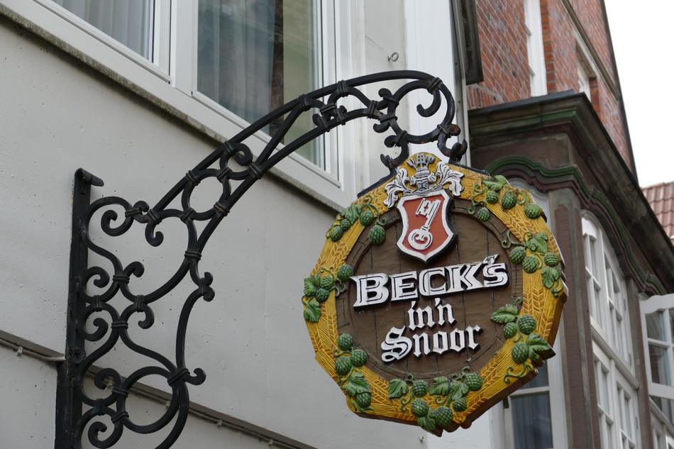 round wooden sign on the wall