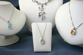 white mannequins in beautiful jewelry.
