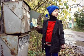 boy and Mailbox in Russia