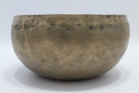 Beautiful old bowl for Buddhism meditation on the white surface