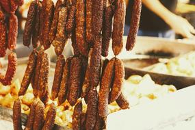 meat sausages hanging in the market