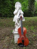 Violin and girl statue garden