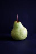 sweet ripe pear on a blue background