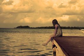 Lonely Girl on Lake pier