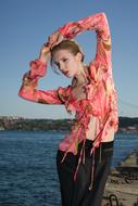 a gorgeous girl in a pink blouse