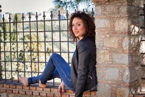 girl sitting on the fence