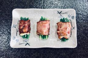vegetables in bacon on a plate